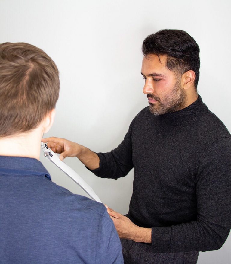 Dr sharm assesing young mans hair