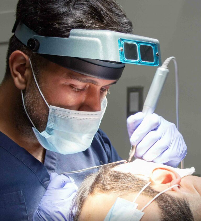 Dr sharma performing hair transplant surgery it all starts with a consultation 2 scaled