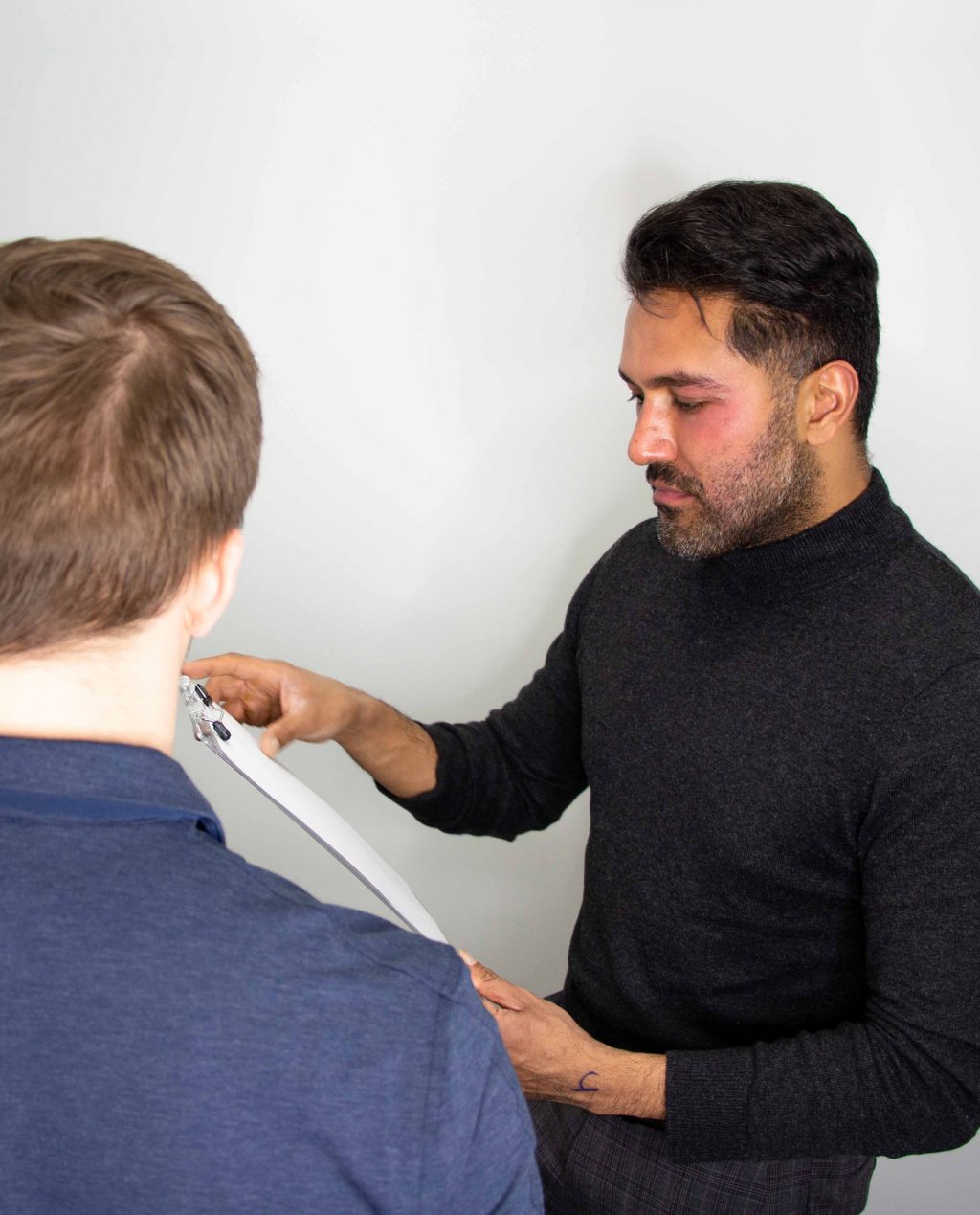 doctor sharma performing crown hair transplantation consultation 1024x1269
